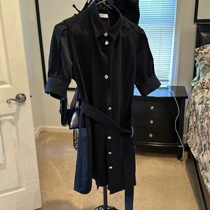 Like new Sandro black dress. Knee length with cute heart buttons.